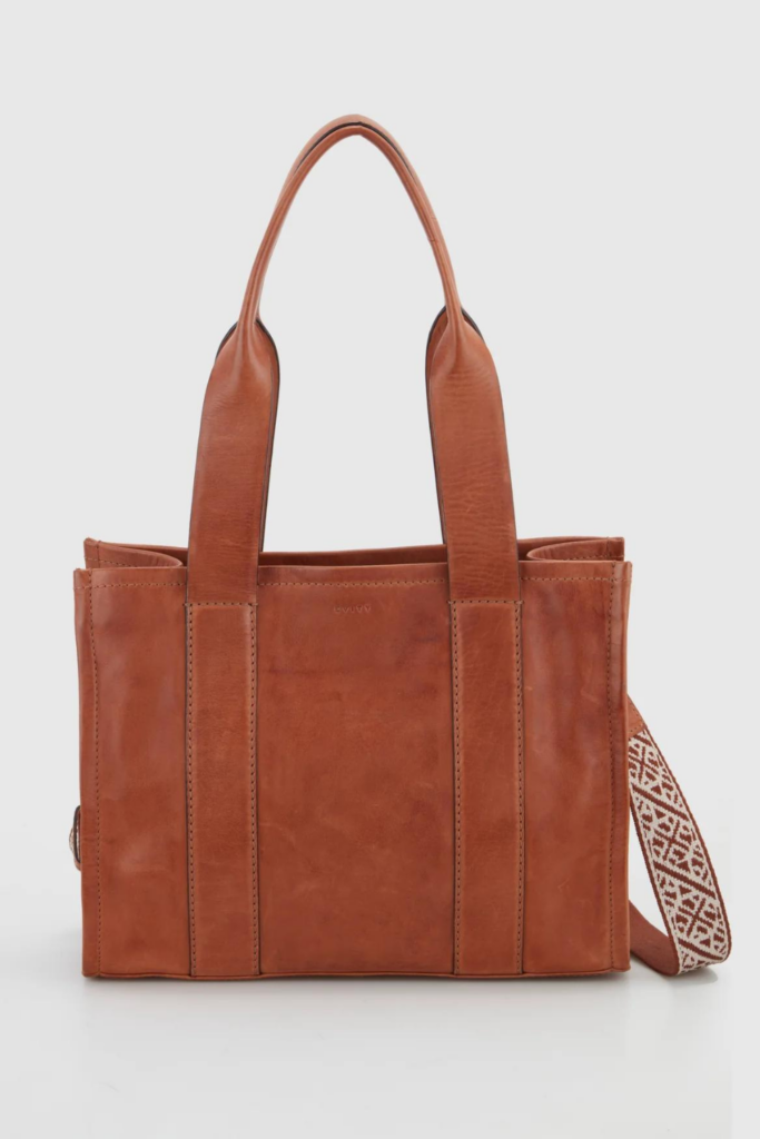 Strandbags brown leather tote bag on a grey background.