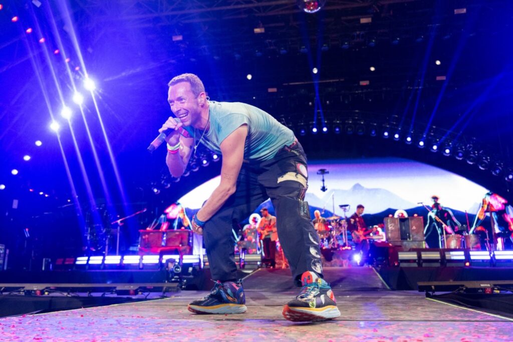 Chris Martin of Coldplay performing at Glastonbury.