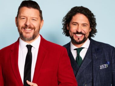 Manu Feildel and Colin Fassnidge smile in suits