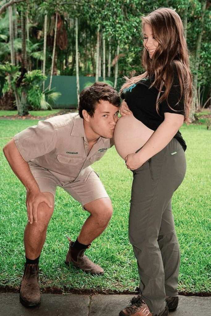 Chandler Powell kissing Bindi Irwin's stomach while she is pregnant. 