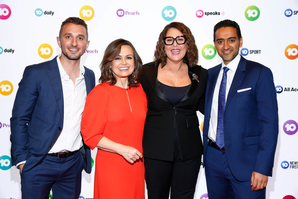 Julia Morris in a red dress with the crew at Network 10 Melbourne Upfronts 2020